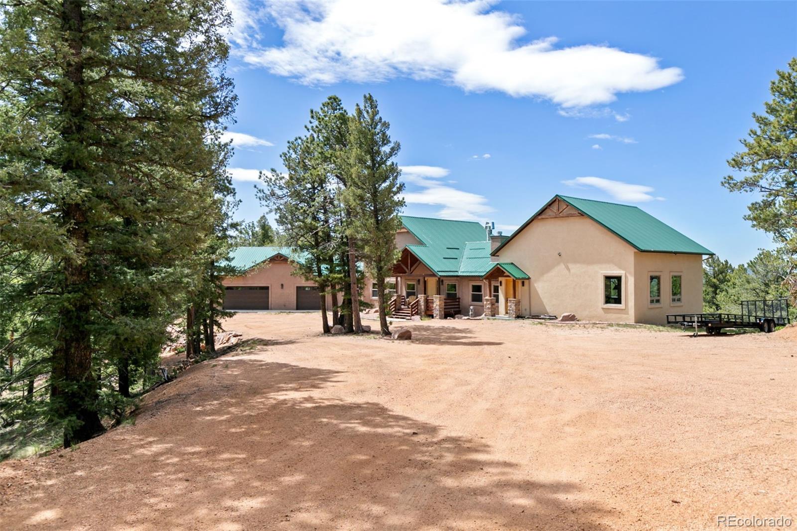 252 Running Elk Point Divide, CO 80814 - Photo 50 of 50 a front view of a house with a yard and garage