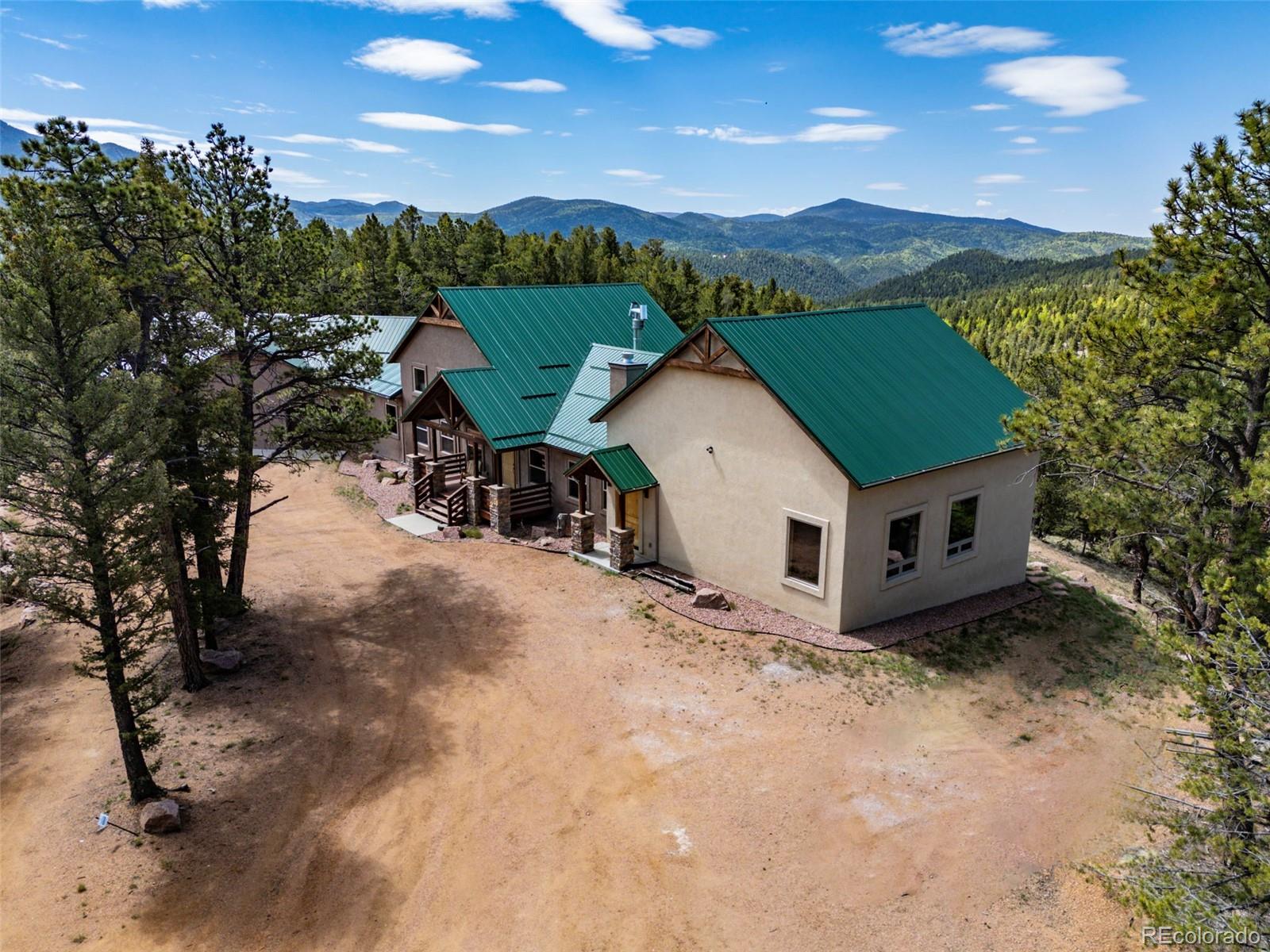 252 Running Elk Point Divide, CO 80814 - Photo 6 of 50 a view of house with outdoor space and sitting area