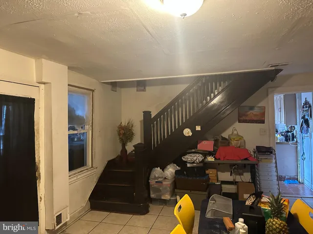 a living room with furniture and entryway