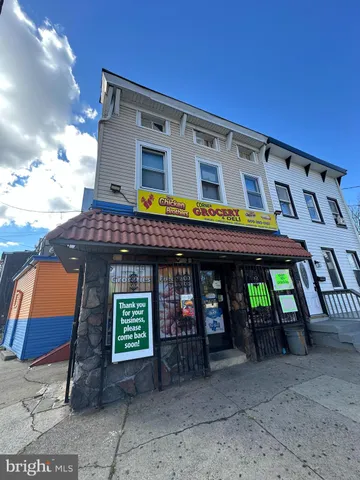 a view of a cafe with sitting area