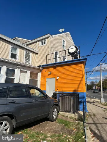 a car parked in front of a house