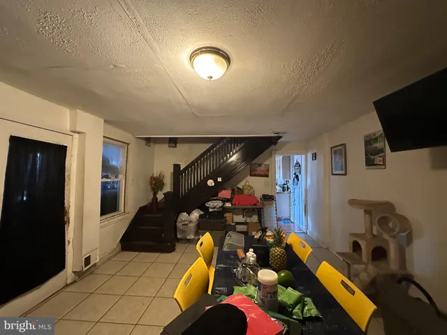 a room with gym equipment and a large window