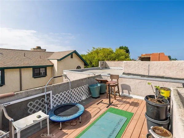 a view of a patio with couches chairs and potted plants