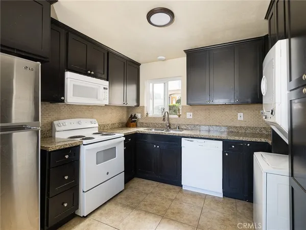 a kitchen with a sink a stove and refrigerator