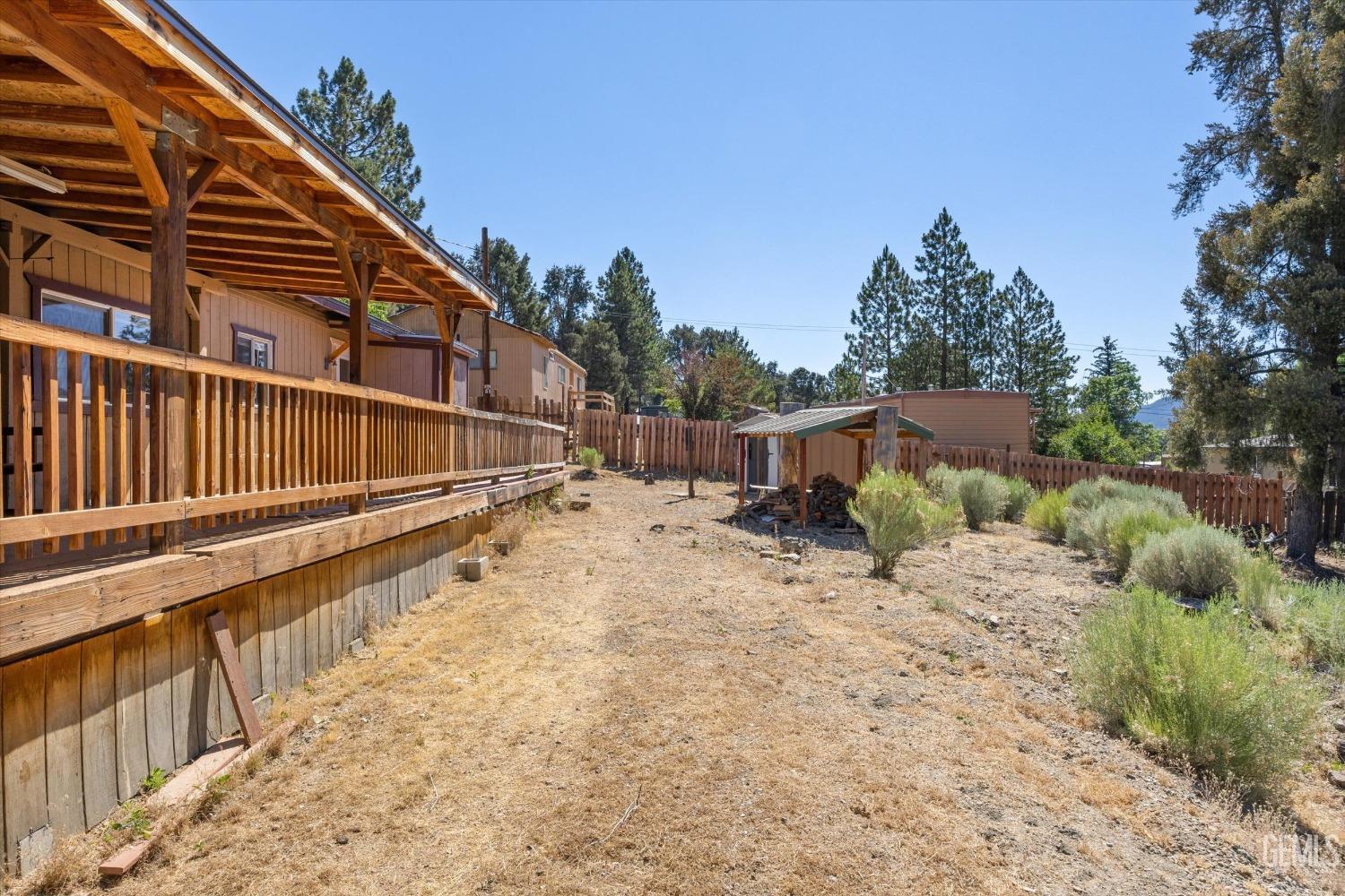Undisclosed Address Pine Mountain Club, CA 93222 - Photo 11 of 22 a view of a house with backyard and trees