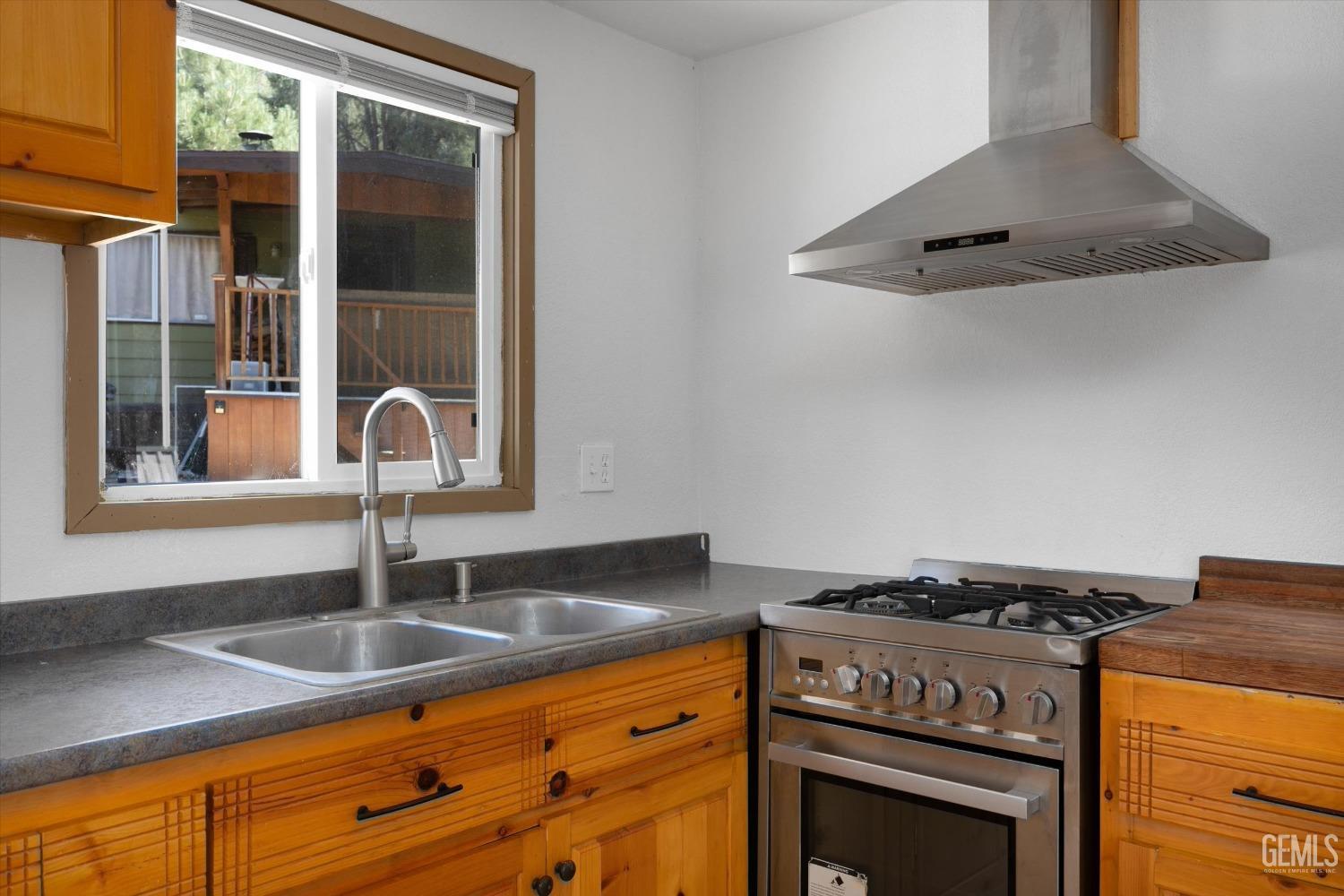 Undisclosed Address Pine Mountain Club, CA 93222 - Photo 18 of 22 a kitchen with granite countertop a sink stainless steel appliances and cabinets