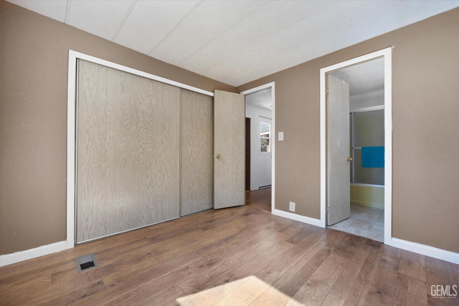 Undisclosed Address Pine Mountain Club, CA 93222 - Photo 20 of 22 a view of an empty room with wooden floor