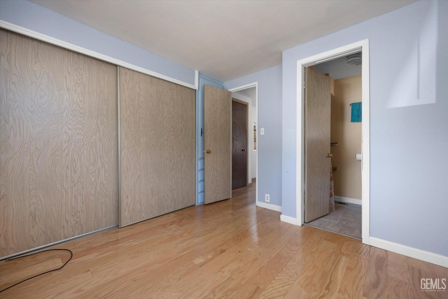 Undisclosed Address Pine Mountain Club, CA 93222 - Photo 6 of 22 an empty room with closet and wooden floor