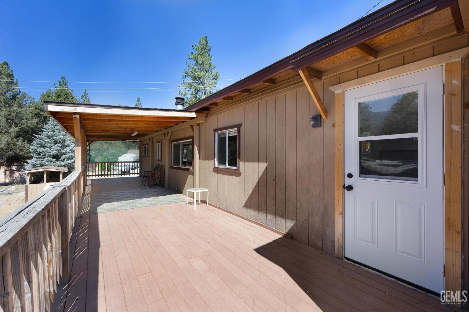 Undisclosed Address Pine Mountain Club, CA 93222 - Photo 8 of 22 a view of a house with roof deck and furniture