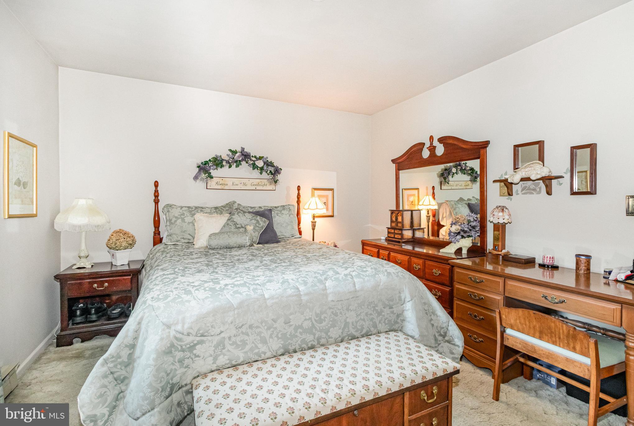 21 Cardinal Drive Carlisle, PA 17015 - Photo 11 of 33 a bedroom with a bed and wooden floor