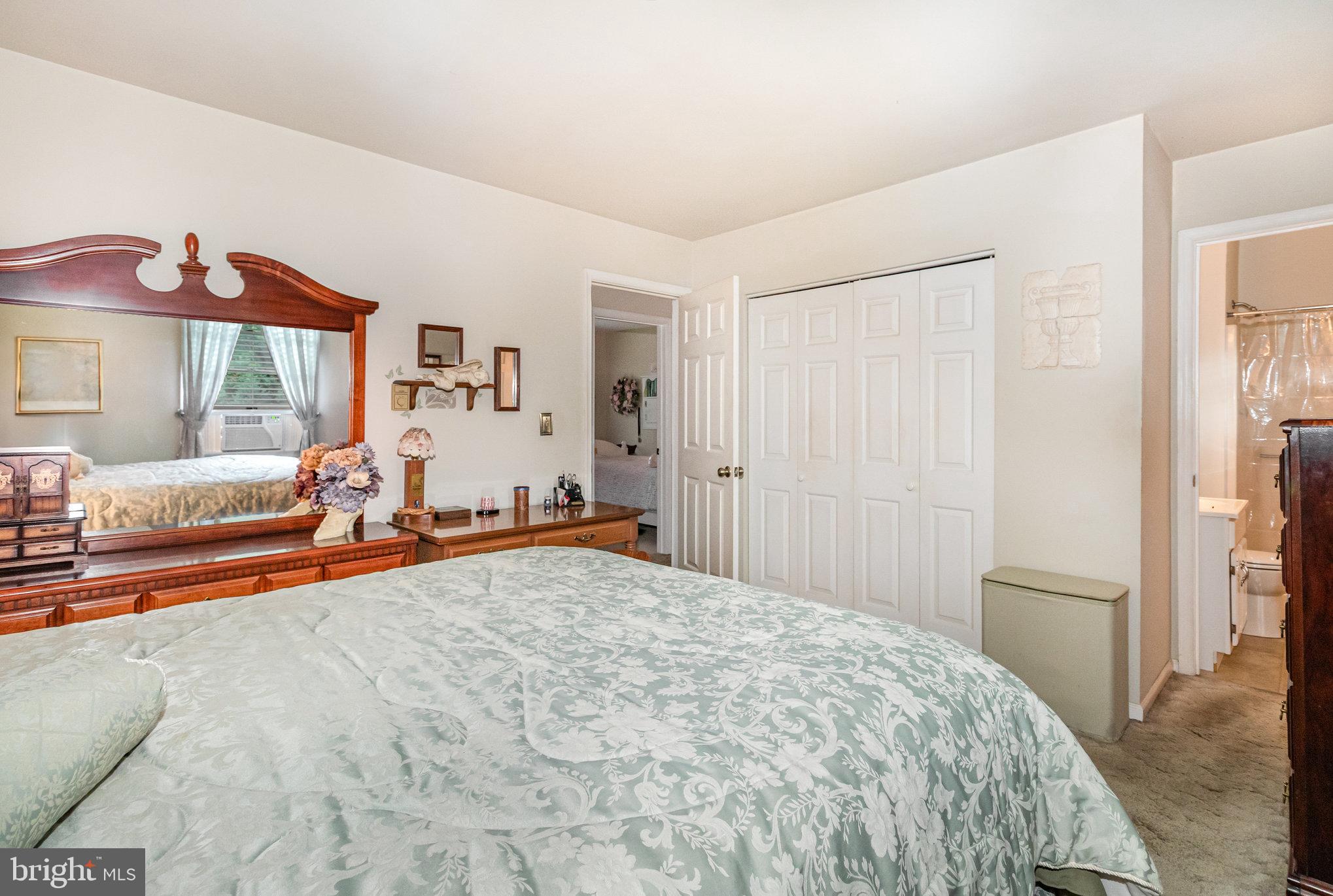 21 Cardinal Drive Carlisle, PA 17015 - Photo 12 of 33 a bed room with a bed and a large mirror