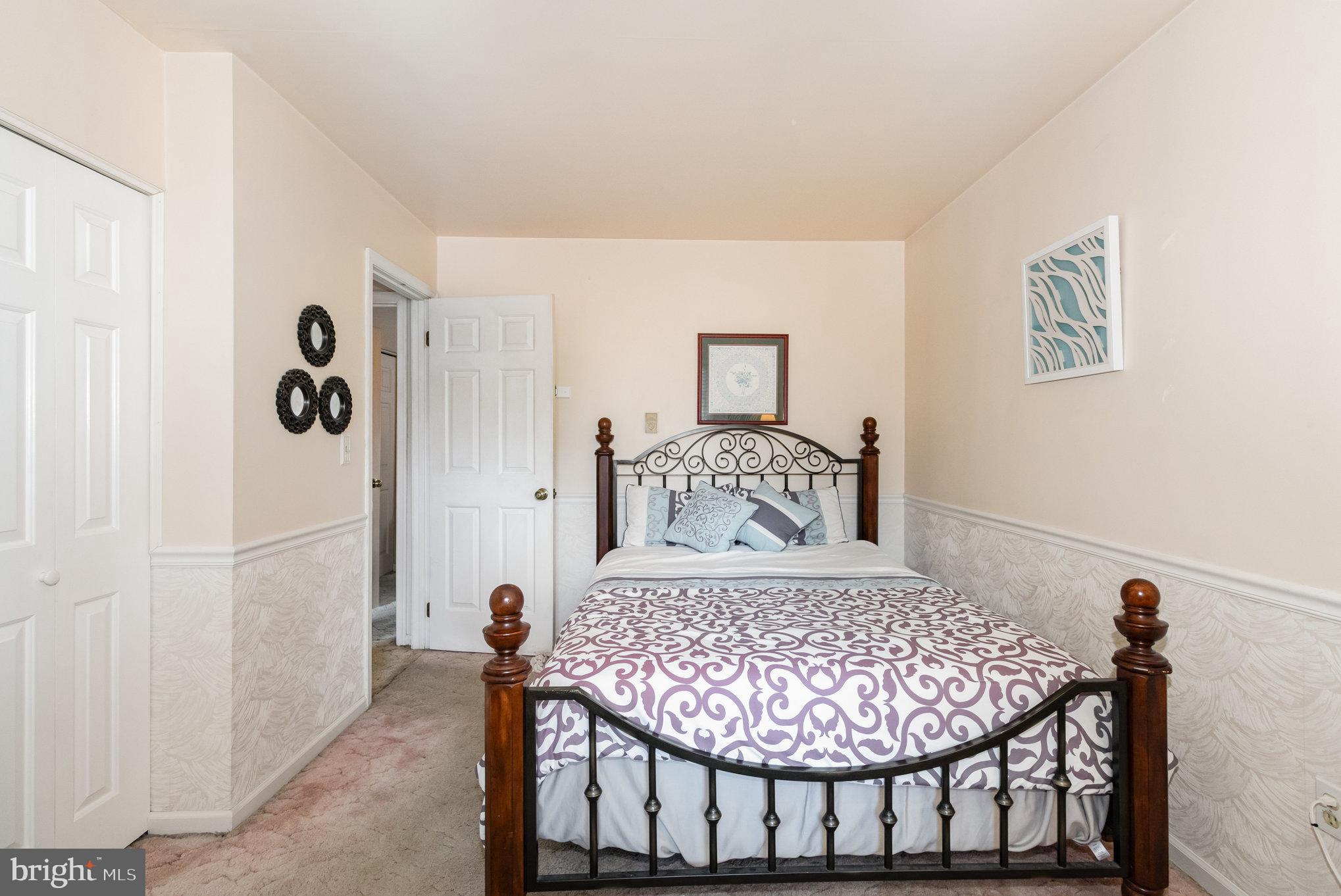 21 Cardinal Drive Carlisle, PA 17015 - Photo 17 of 33 a bedroom with a bed and a table