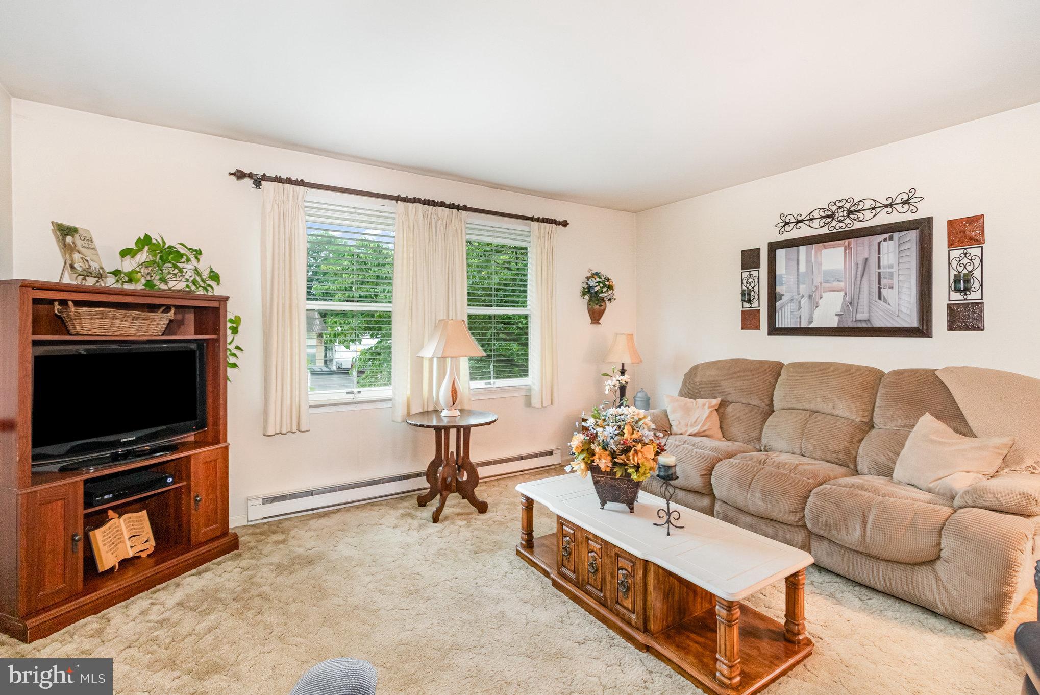 21 Cardinal Drive Carlisle, PA 17015 - Photo 2 of 33 a living room with furniture and a flat screen tv