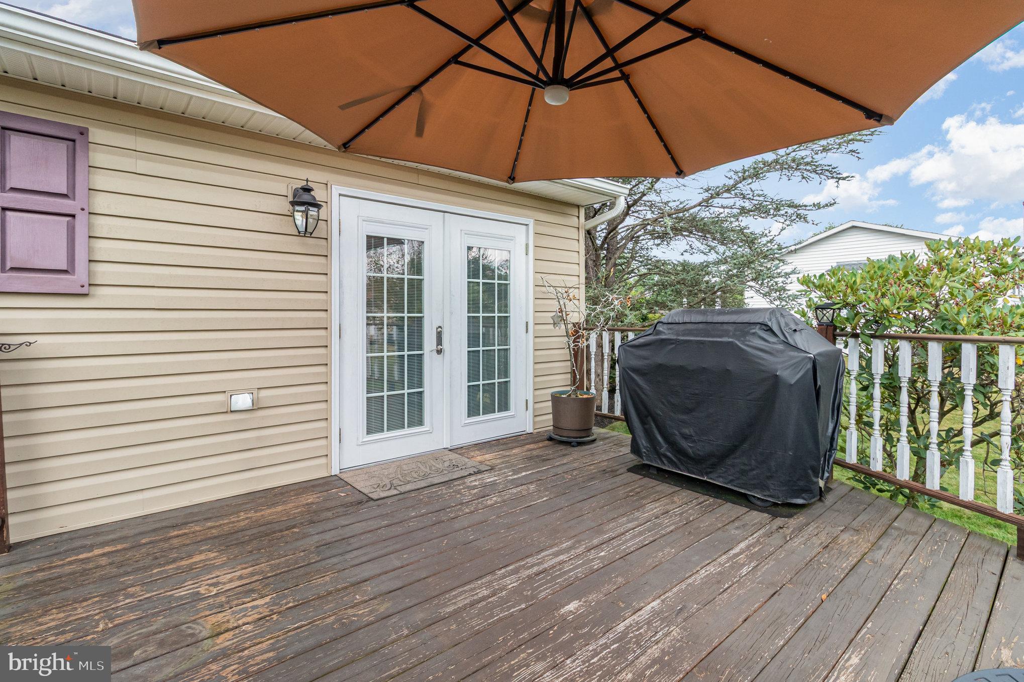 21 Cardinal Drive Carlisle, PA 17015 - Photo 22 of 33 a view of a backyard with wooden floor and roof
