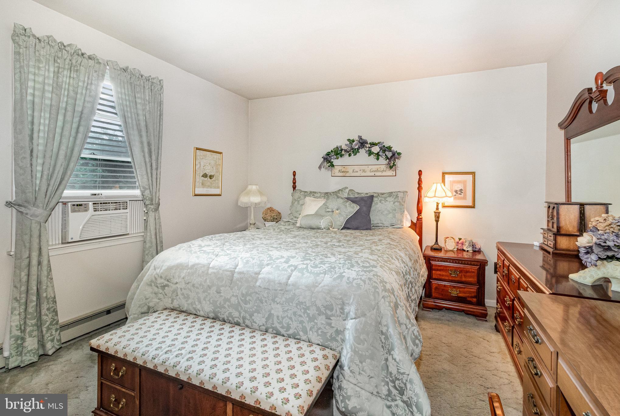 21 Cardinal Drive Carlisle, PA 17015 - Photo 10 of 33 a bedroom with a bed and wooden floor