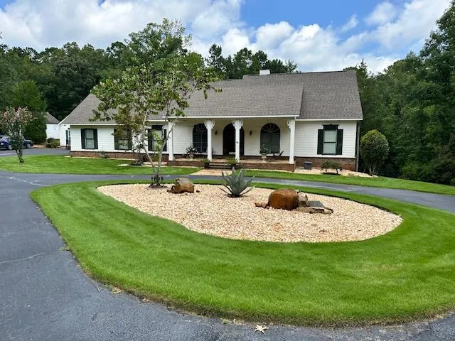 a front view of a house with a yard