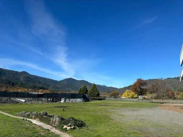 a view of a town with mountains in the background