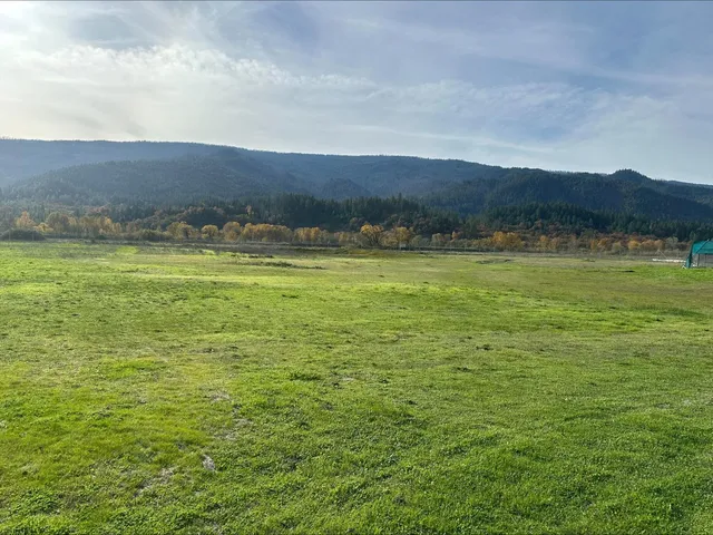 a view of an ocean and a mountain