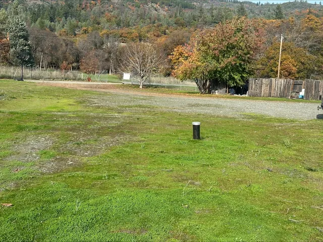a view of a lake with a yard