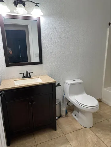 a bathroom with a sink and a toilet