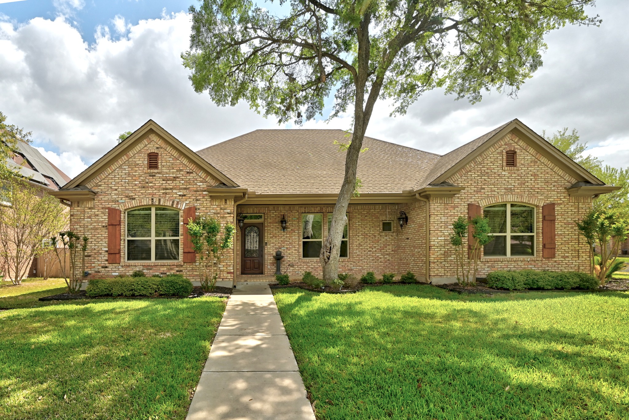 front view of a house with a yard