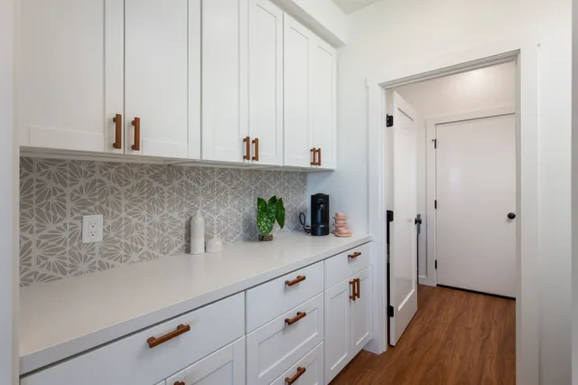 a view of cabinets with wooden floor