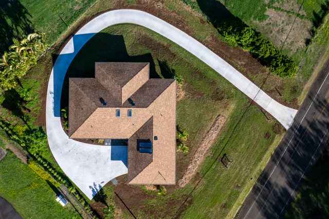 an aerial view of a house with outdoor space