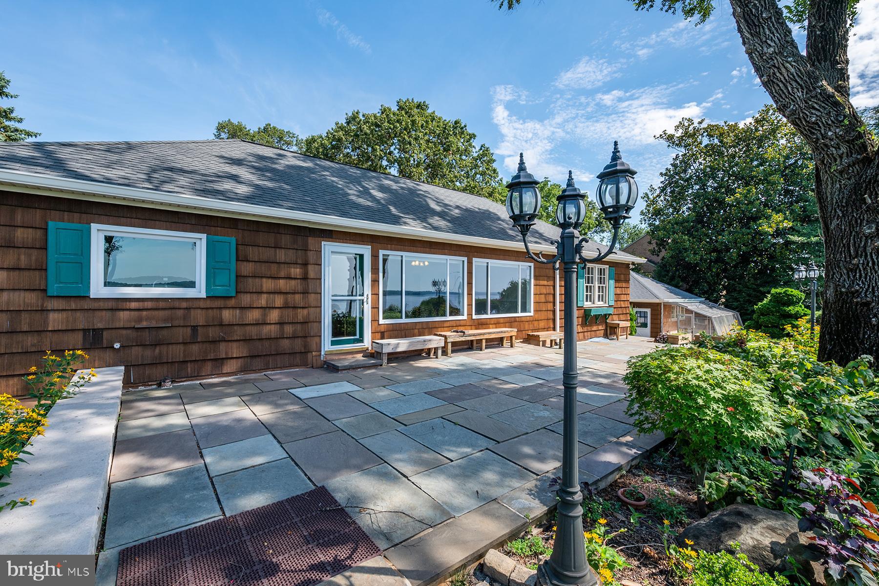 371 North Ferry Point Road Pasadena, MD 21122 - Photo 21 of 50 Large flagstone patio on the waterside