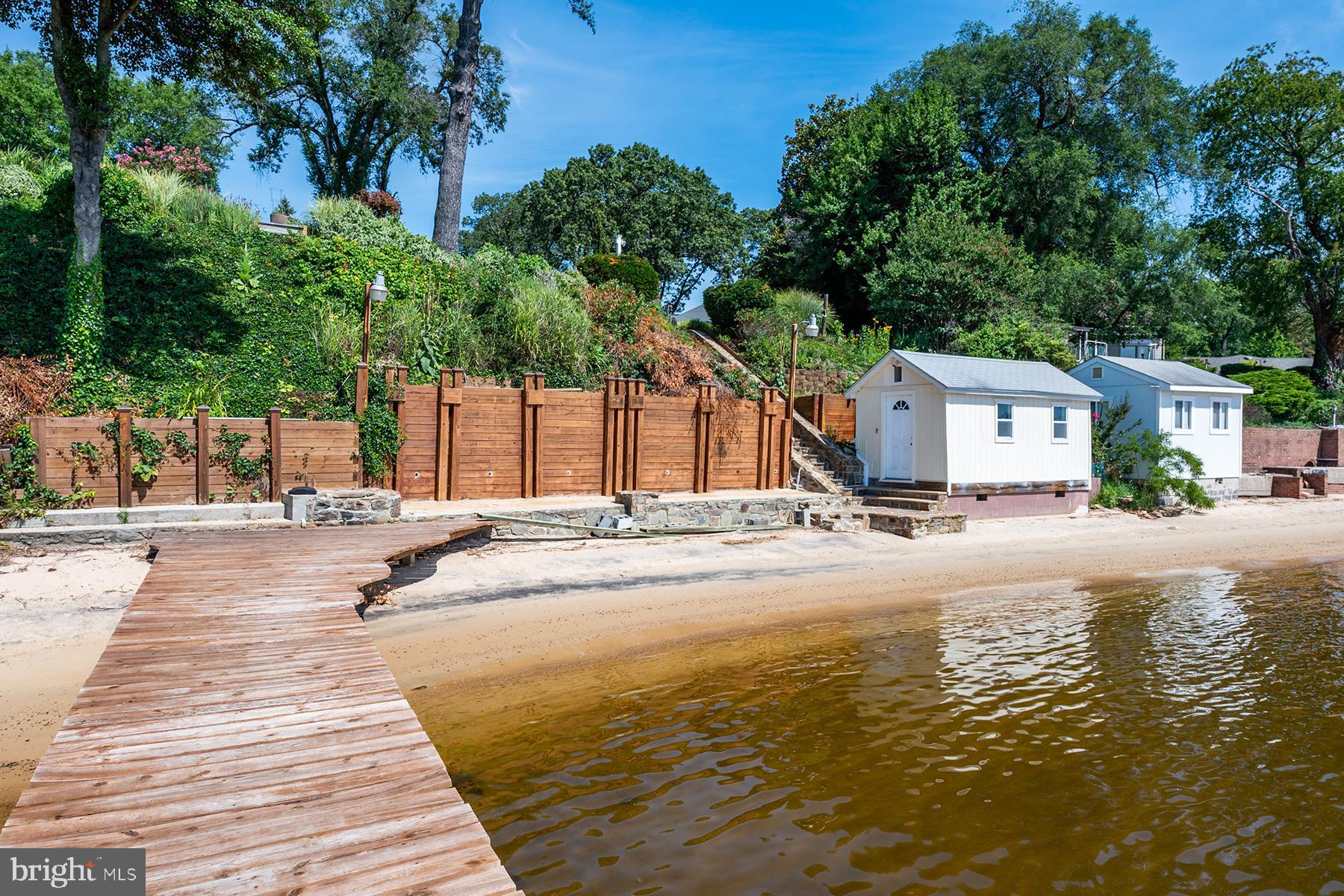 371 North Ferry Point Road Pasadena, MD 21122 - Photo 38 of 50 Private beach and a storage shed by the water