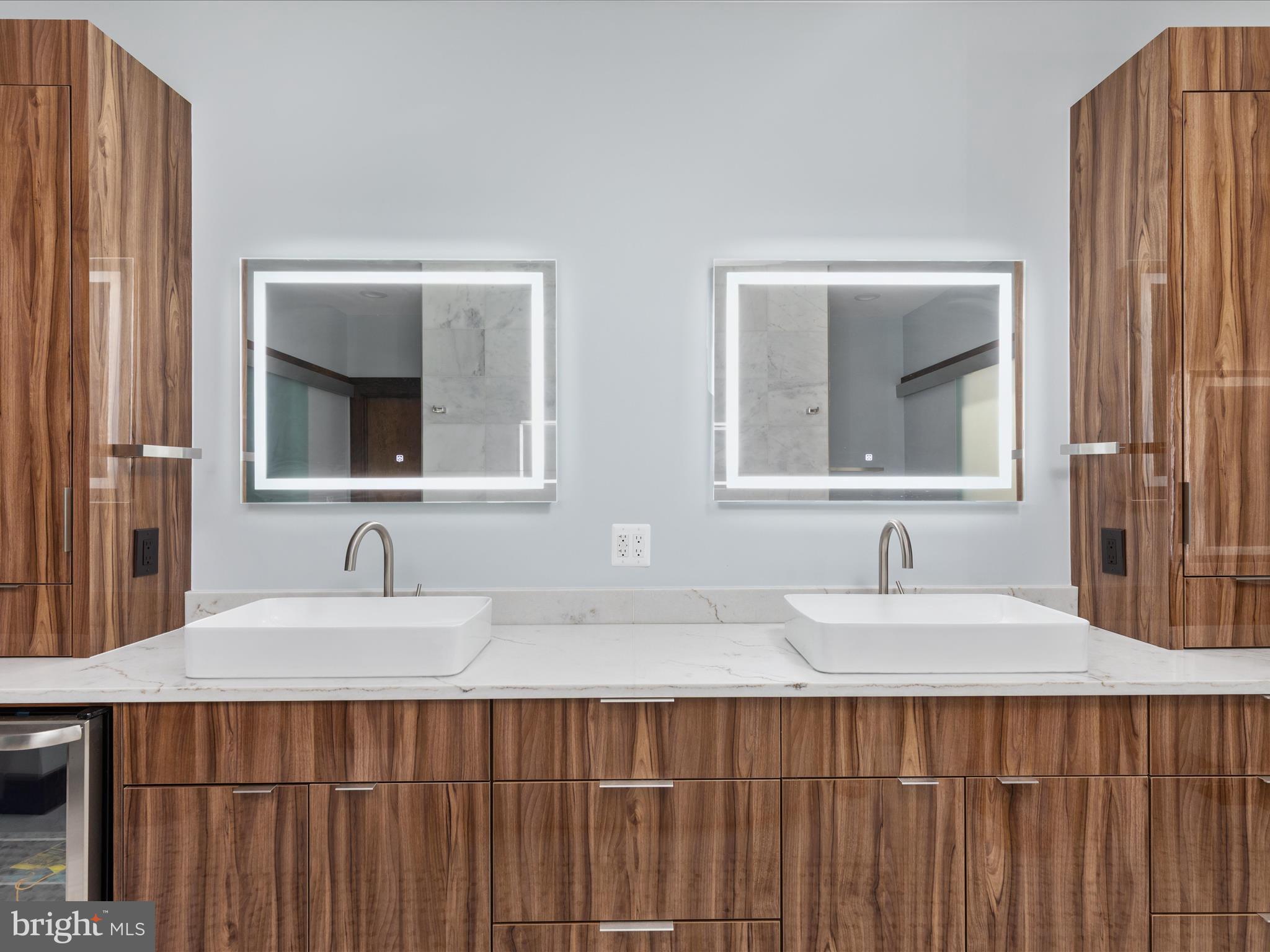 9711 Meadowlark Road Vienna, VA 22182 - Photo 34 of 66 a bathroom with double vanity sink and a mirror