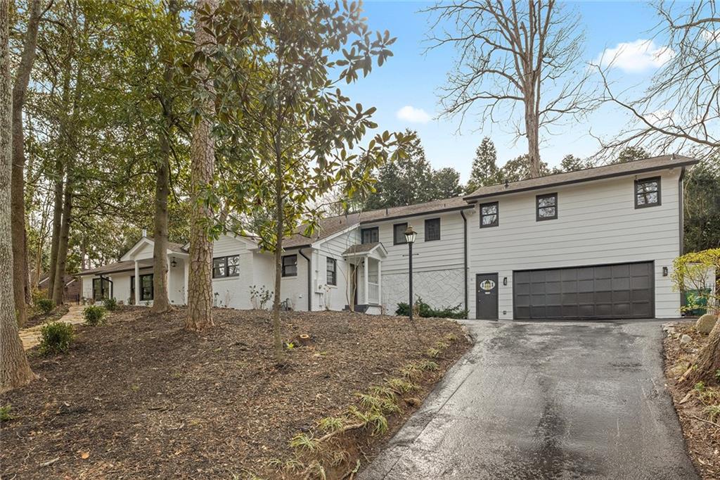 1275 The By Way Northeast Atlanta, GA 30306 - Photo 48 of 50 a white house that has a tree on the side of it