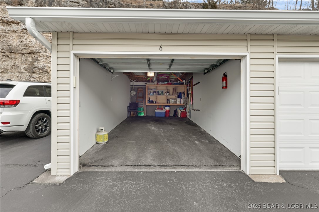 770 Pershing Drive, Unit 3A Camdenton, MO 65020 - Photo 29 of 39 Garage with lots of storage