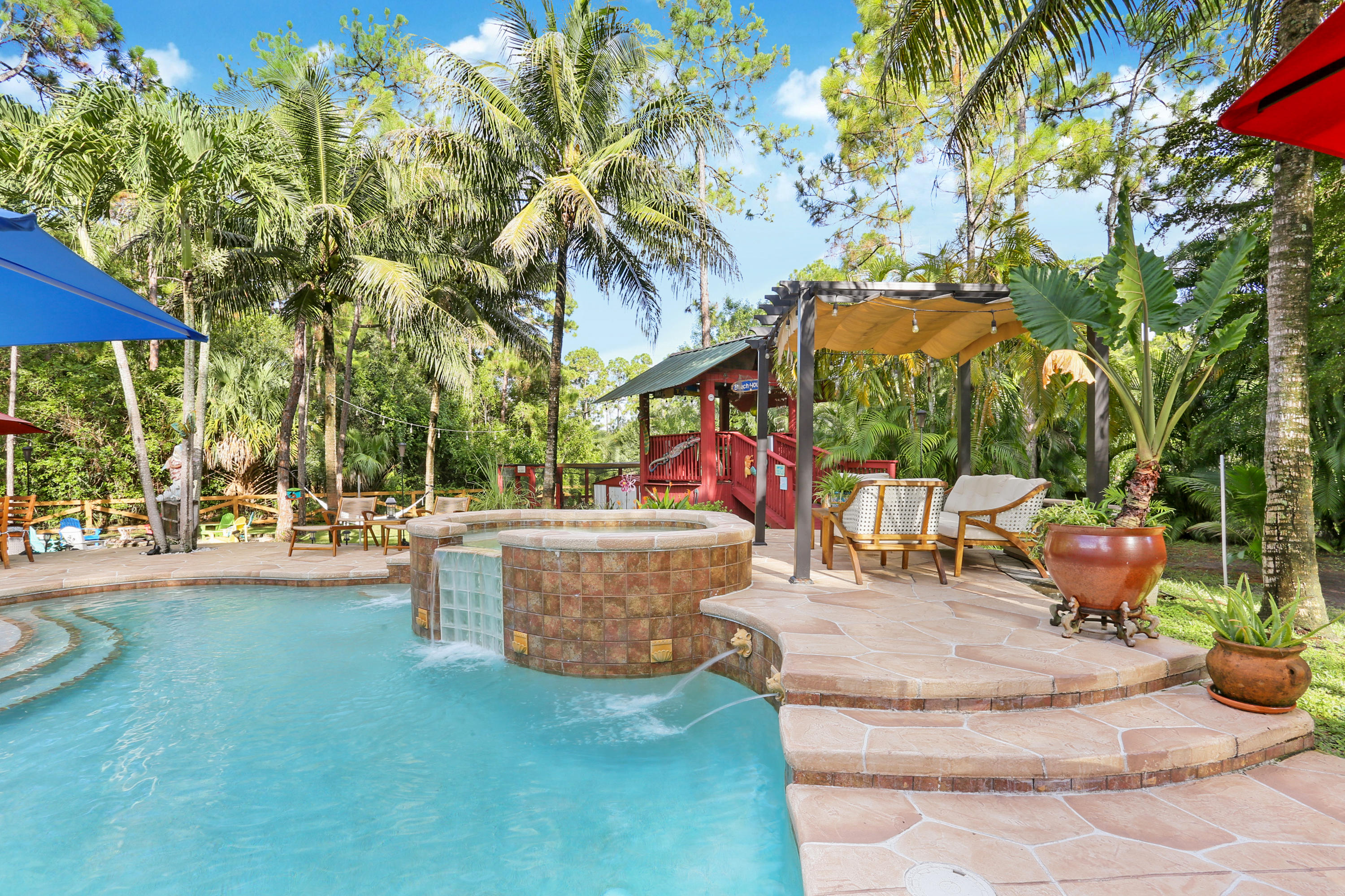 18604 43rd Road North Loxahatchee, FL 33470 - Photo 14 of 40 a view of a backyard with swimming pool