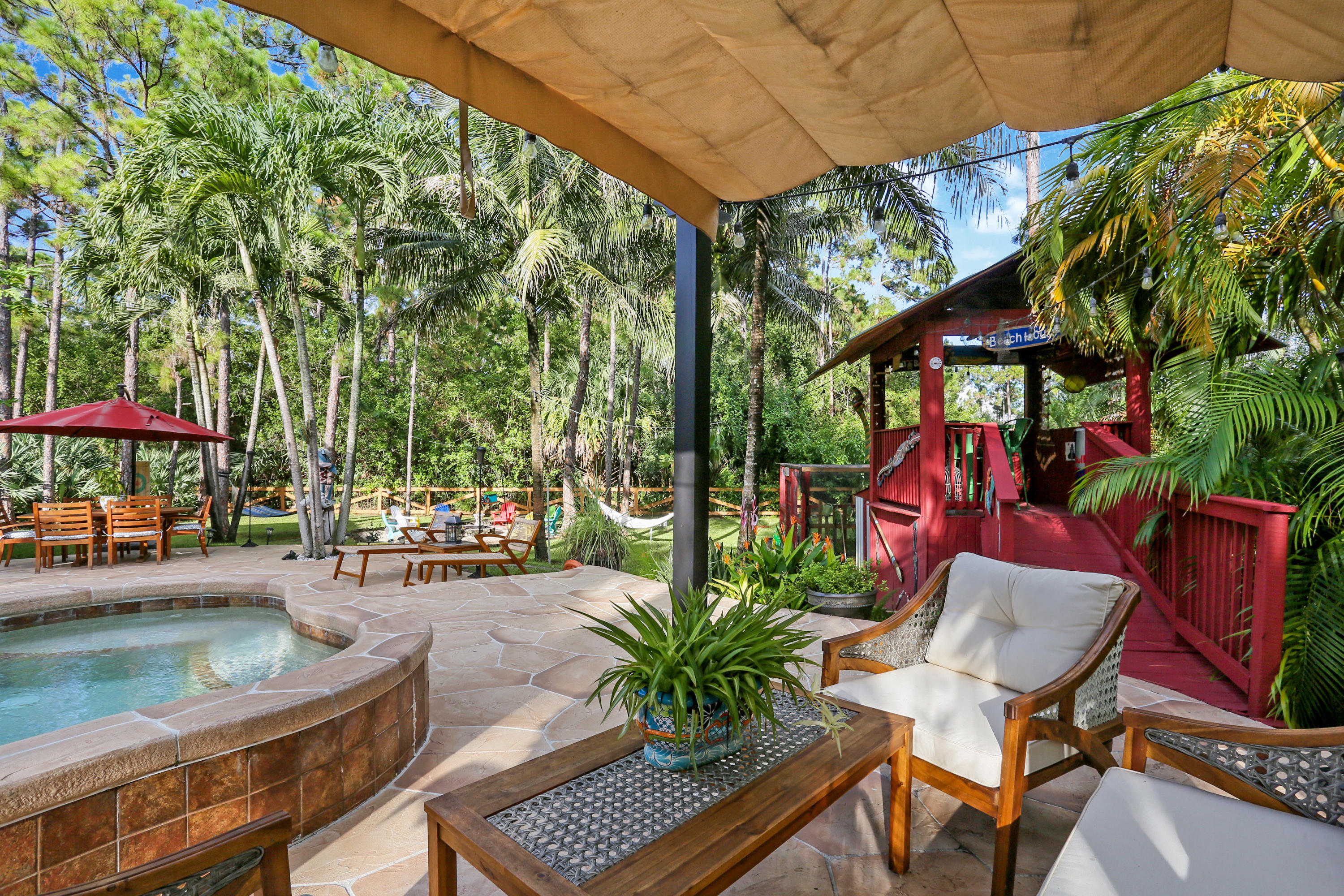 18604 43rd Road North Loxahatchee, FL 33470 - Photo 15 of 40 a view of a chairs and table in the patio