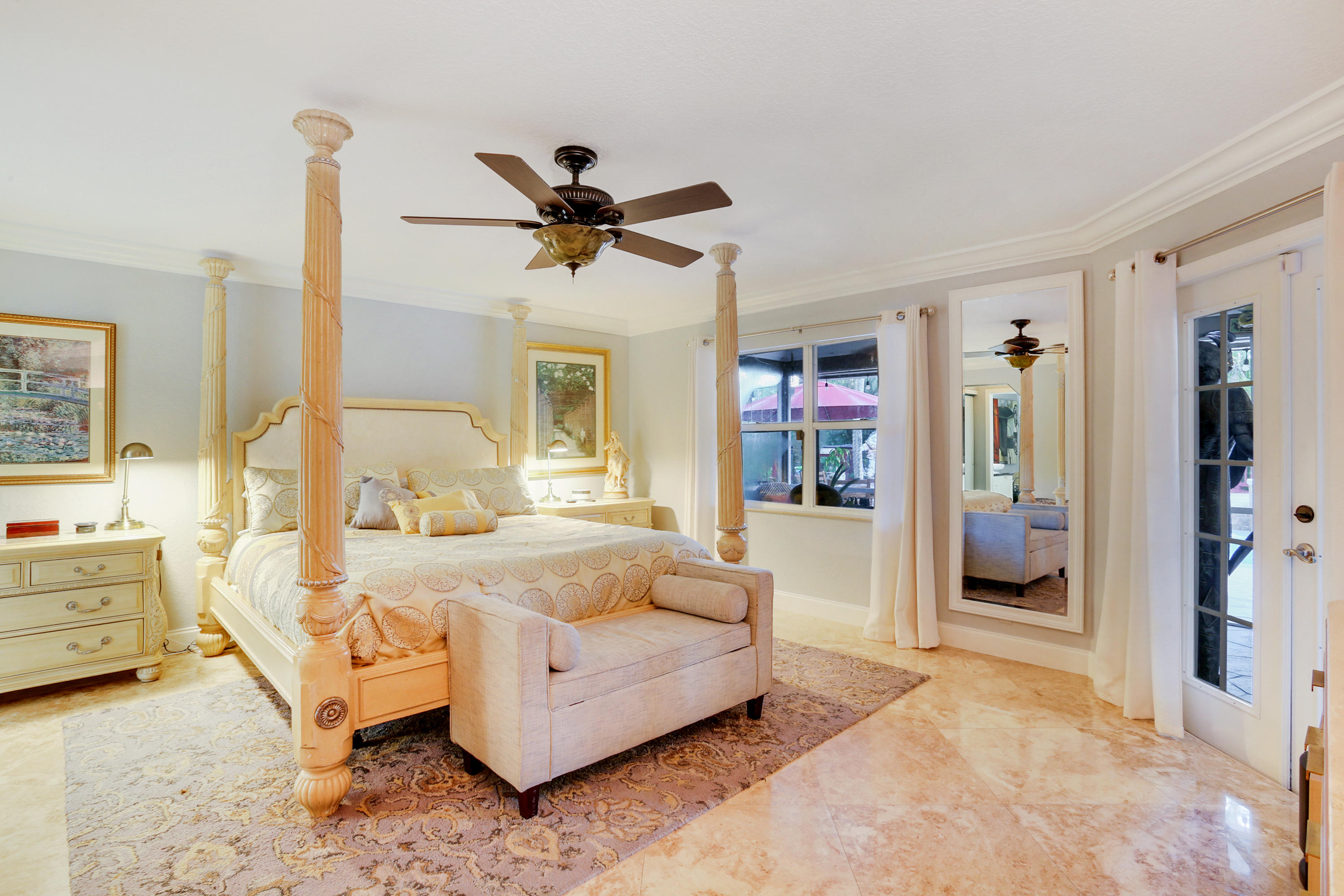 18604 43rd Road North Loxahatchee, FL 33470 - Photo 28 of 40 a spacious bedroom with a bed couch and window