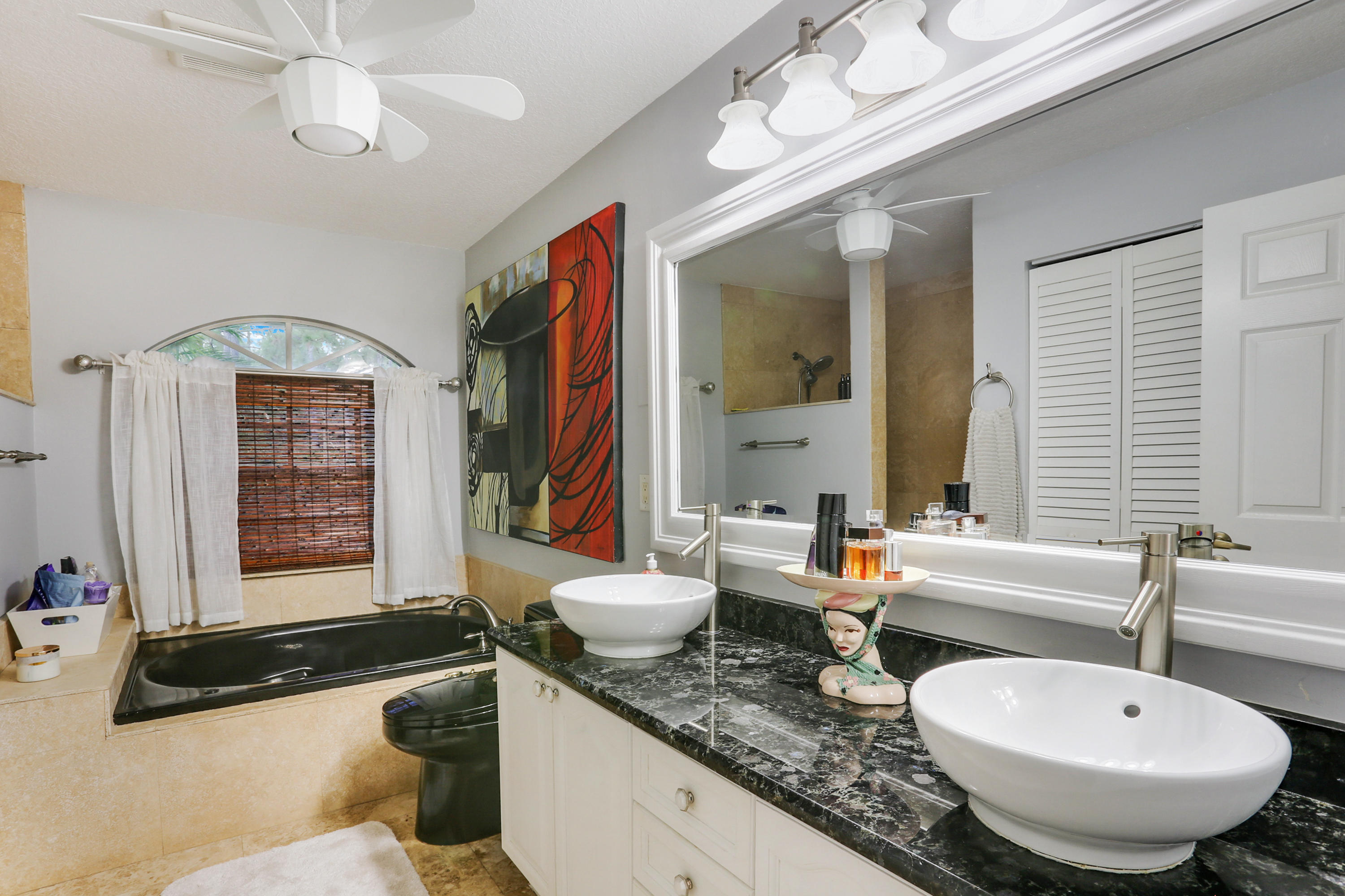 18604 43rd Road North Loxahatchee, FL 33470 - Photo 29 of 40 a bathroom with a granite countertop sink and a mirror