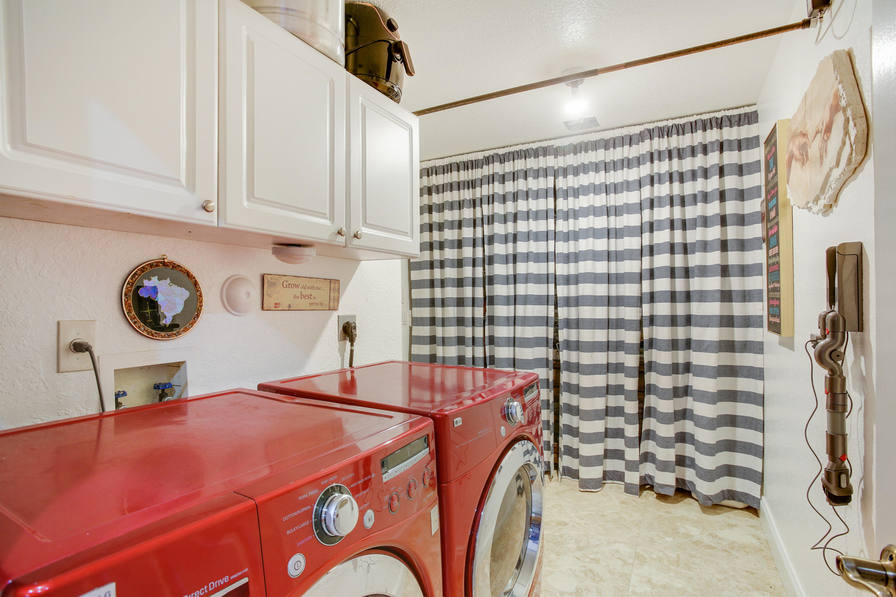 18604 43rd Road North Loxahatchee, FL 33470 - Photo 40 of 40 a bedroom with a bed and a chandelier