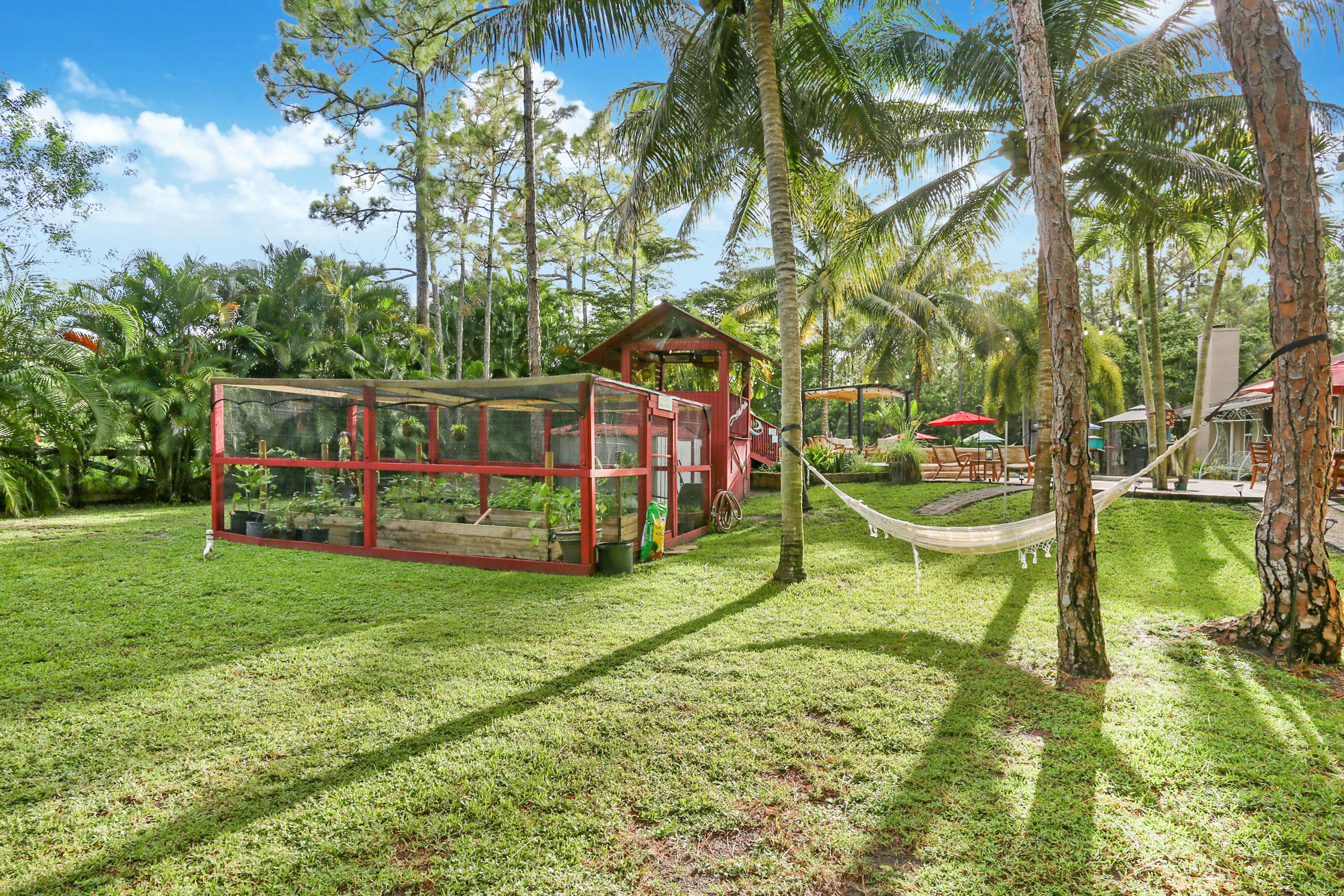 18604 43rd Road North Loxahatchee, FL 33470 - Photo 10 of 40 a view of a house with backyard and sitting area