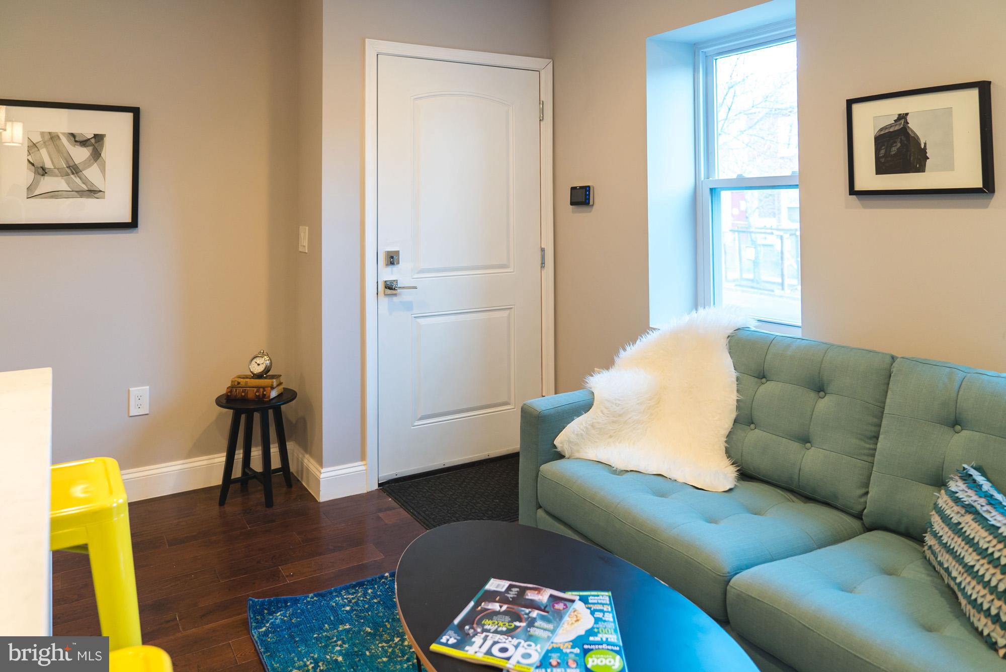 a living room with furniture and a rug