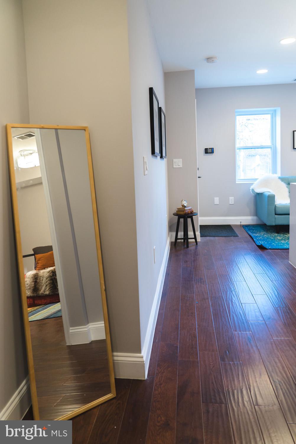 1823 D Street Northeast, Unit B Washington, DC 20002 - Photo 11 of 27 a view of a room with wooden floor and a window