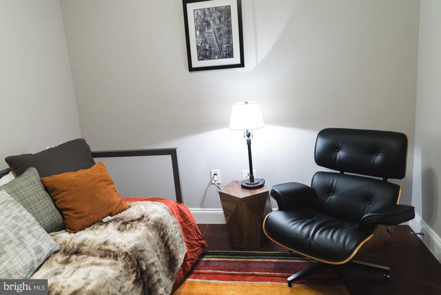 a bedroom with a bed and lamp