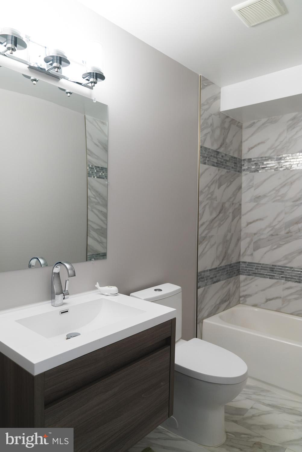 1823 D Street Northeast, Unit B Washington, DC 20002 - Photo 17 of 27 a bathroom with a sink toilet and shower