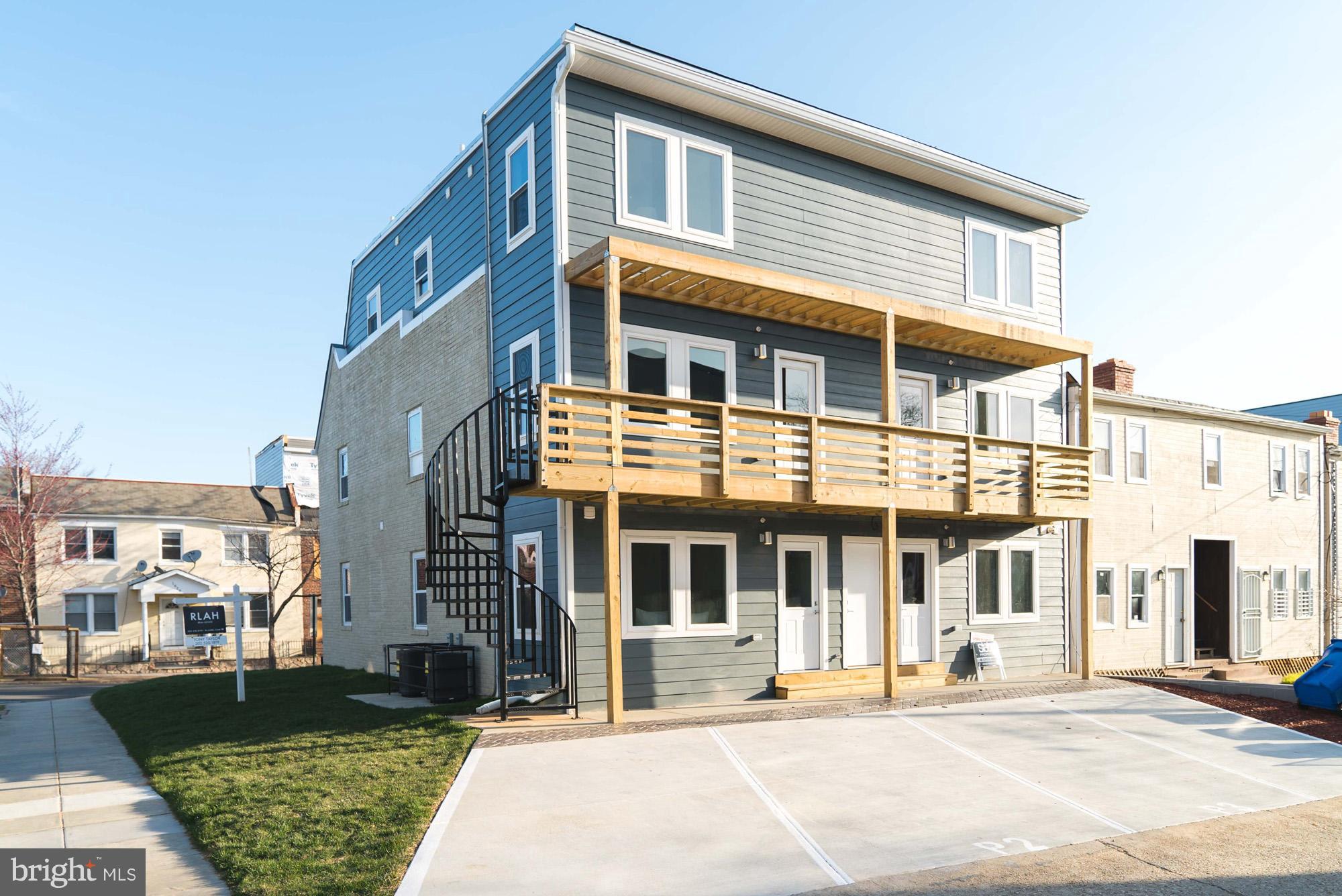 1823 D Street Northeast, Unit B Washington, DC 20002 - Photo 25 of 27 a front view of a building and a yard