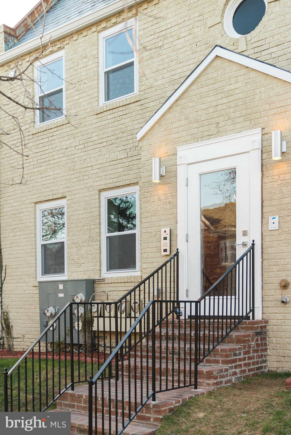 1823 D Street Northeast, Unit B Washington, DC 20002 - Photo 26 of 27 a view of a brick house with large windows