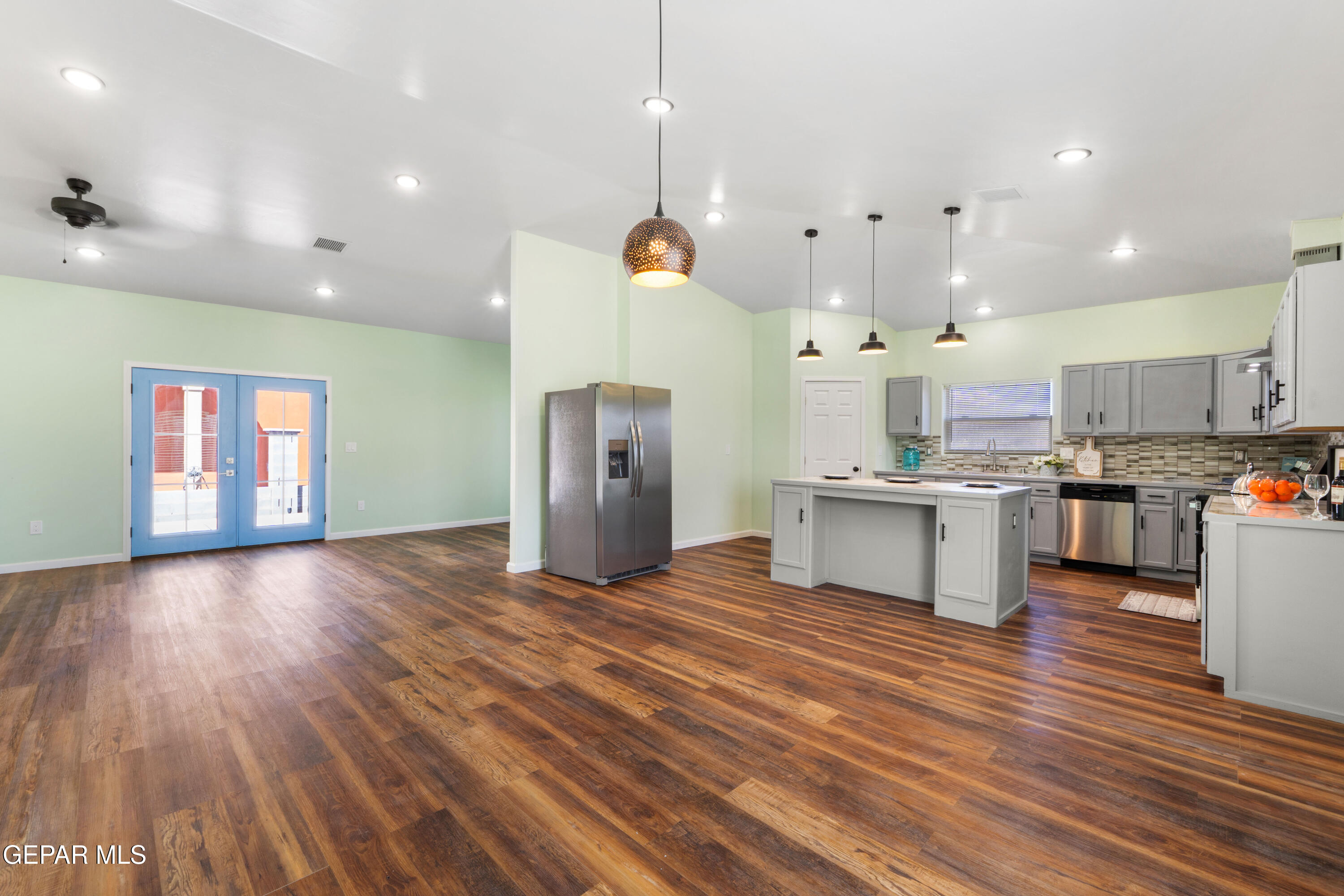 646 Snow Road, Unit 2 Las Cruces, NM 88005 - Photo 11 of 41 a view of kitchen with cabinets appliances and wooden floor