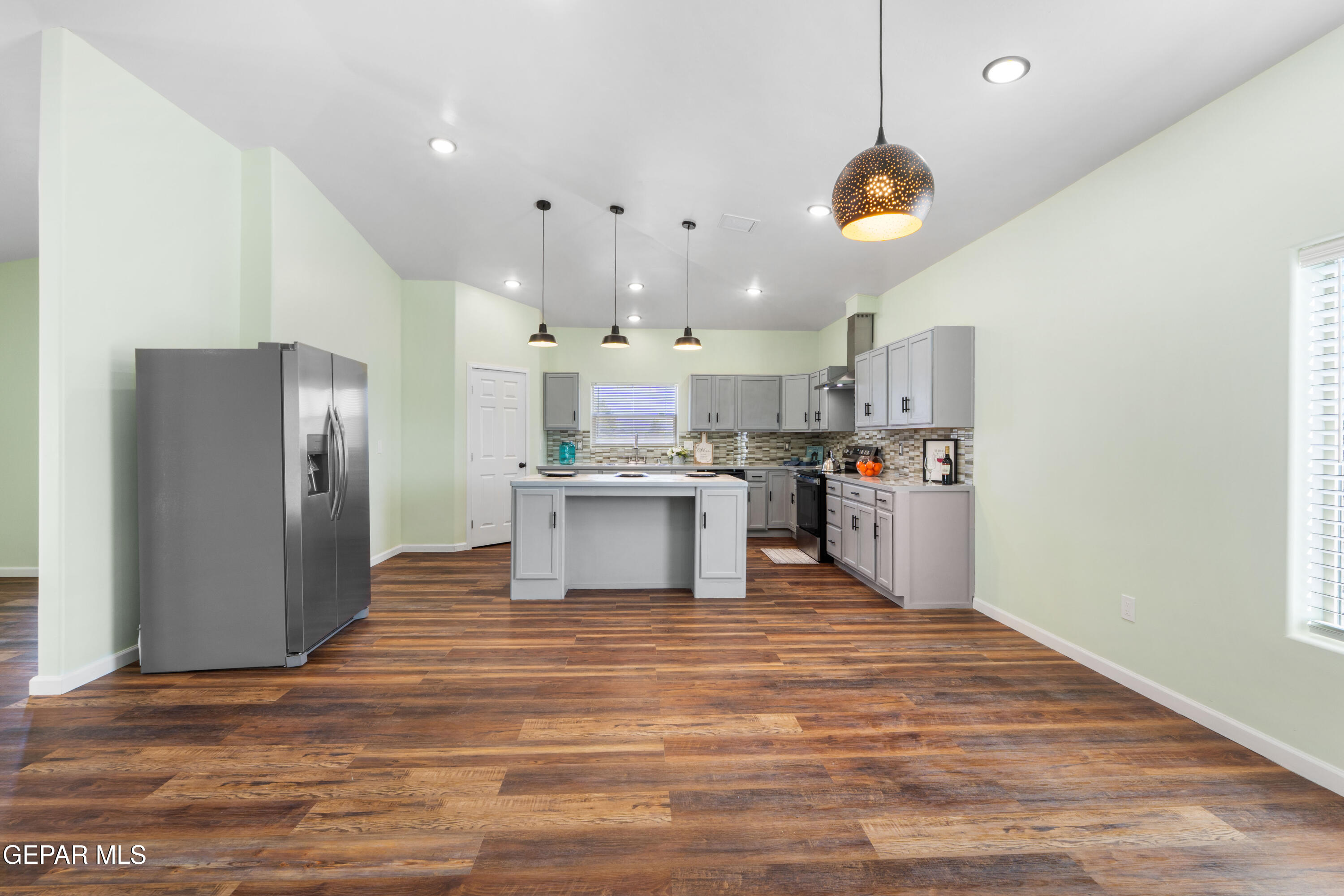 646 Snow Road, Unit 2 Las Cruces, NM 88005 - Photo 15 of 41 a view of kitchen with kitchen island microwave and cabinets