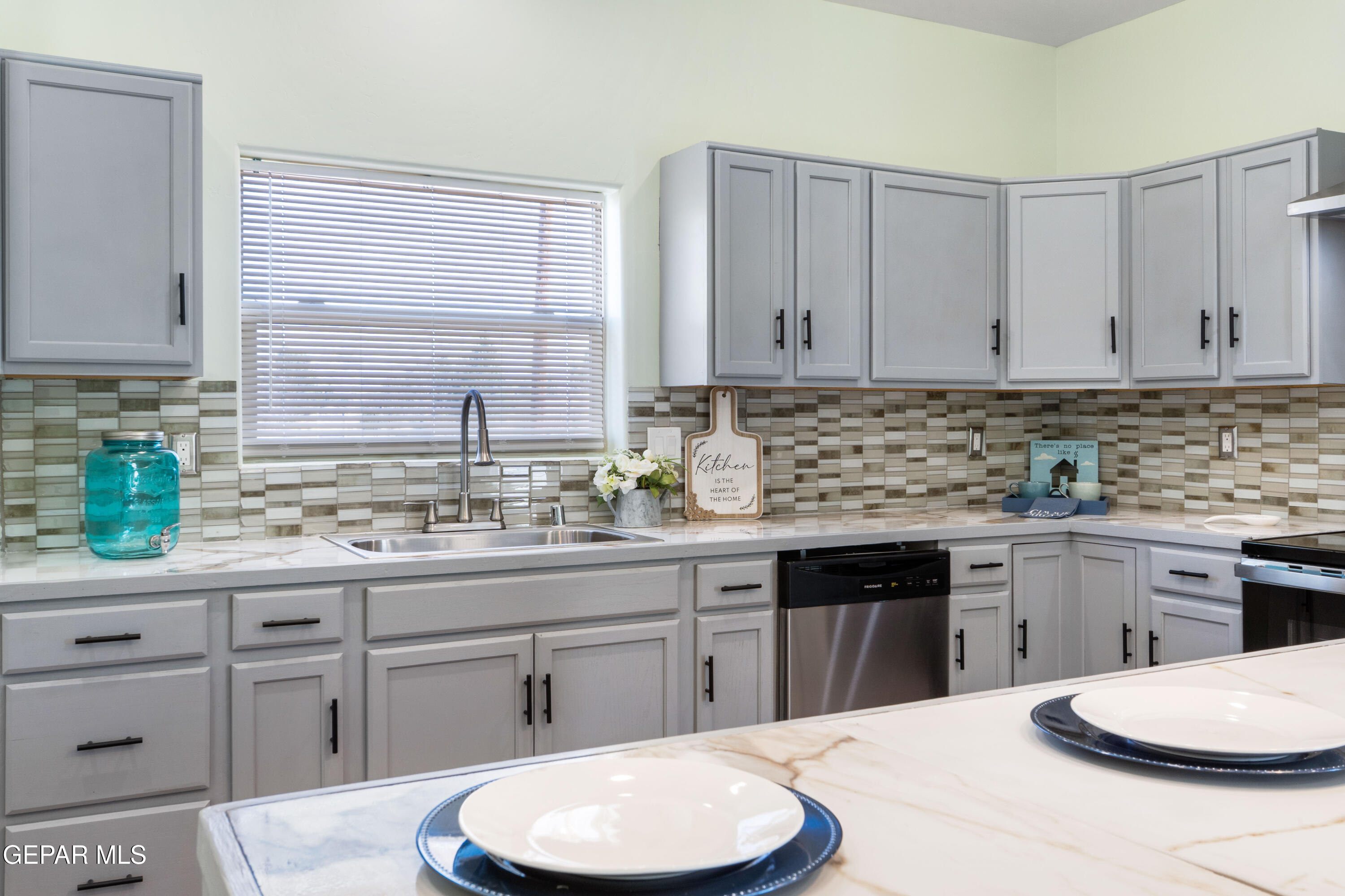 646 Snow Road, Unit 2 Las Cruces, NM 88005 - Photo 20 of 41 a kitchen with a white cabinets and white appliances