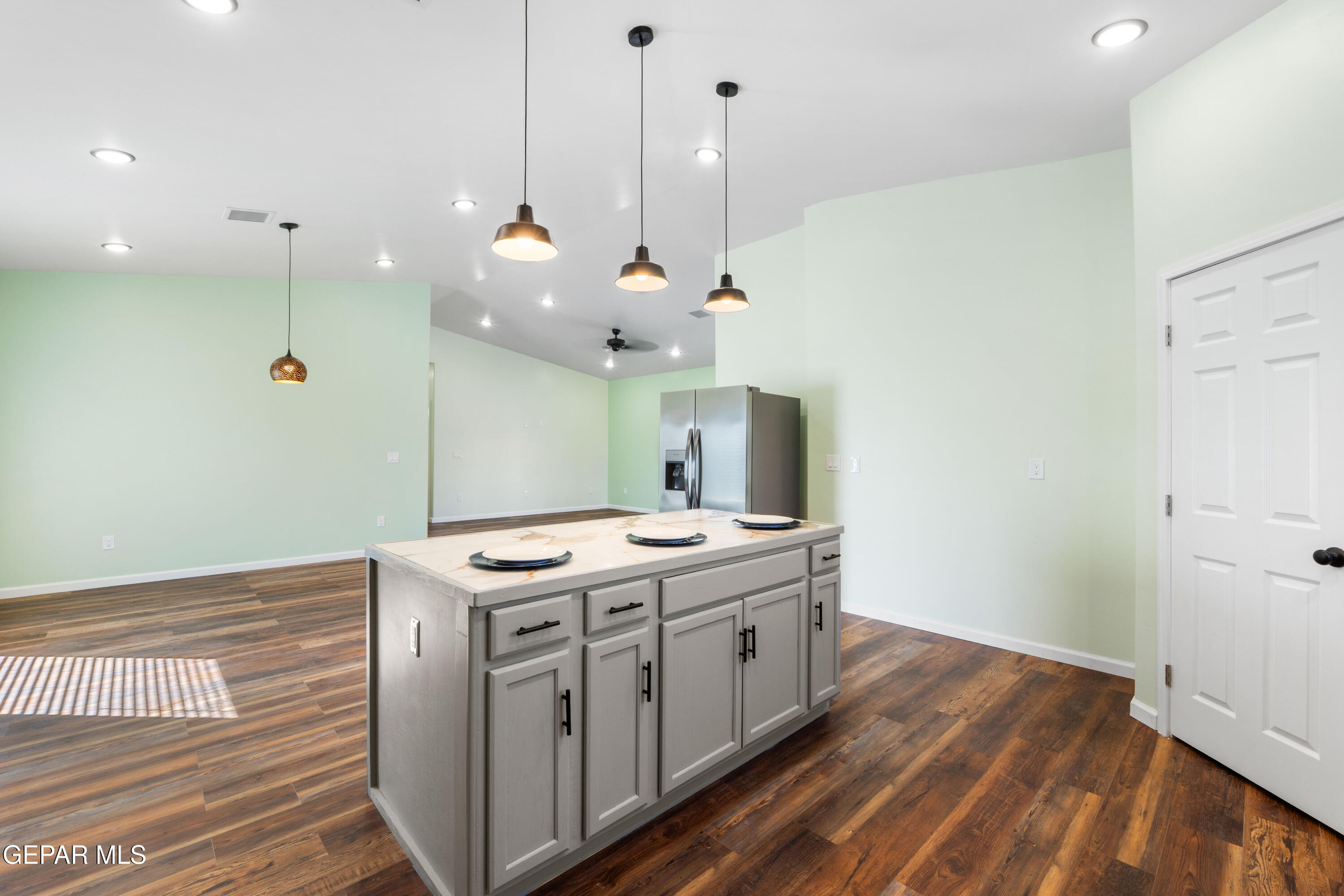 646 Snow Road, Unit 2 Las Cruces, NM 88005 - Photo 21 of 41 a kitchen that has a stove and a wooden floor