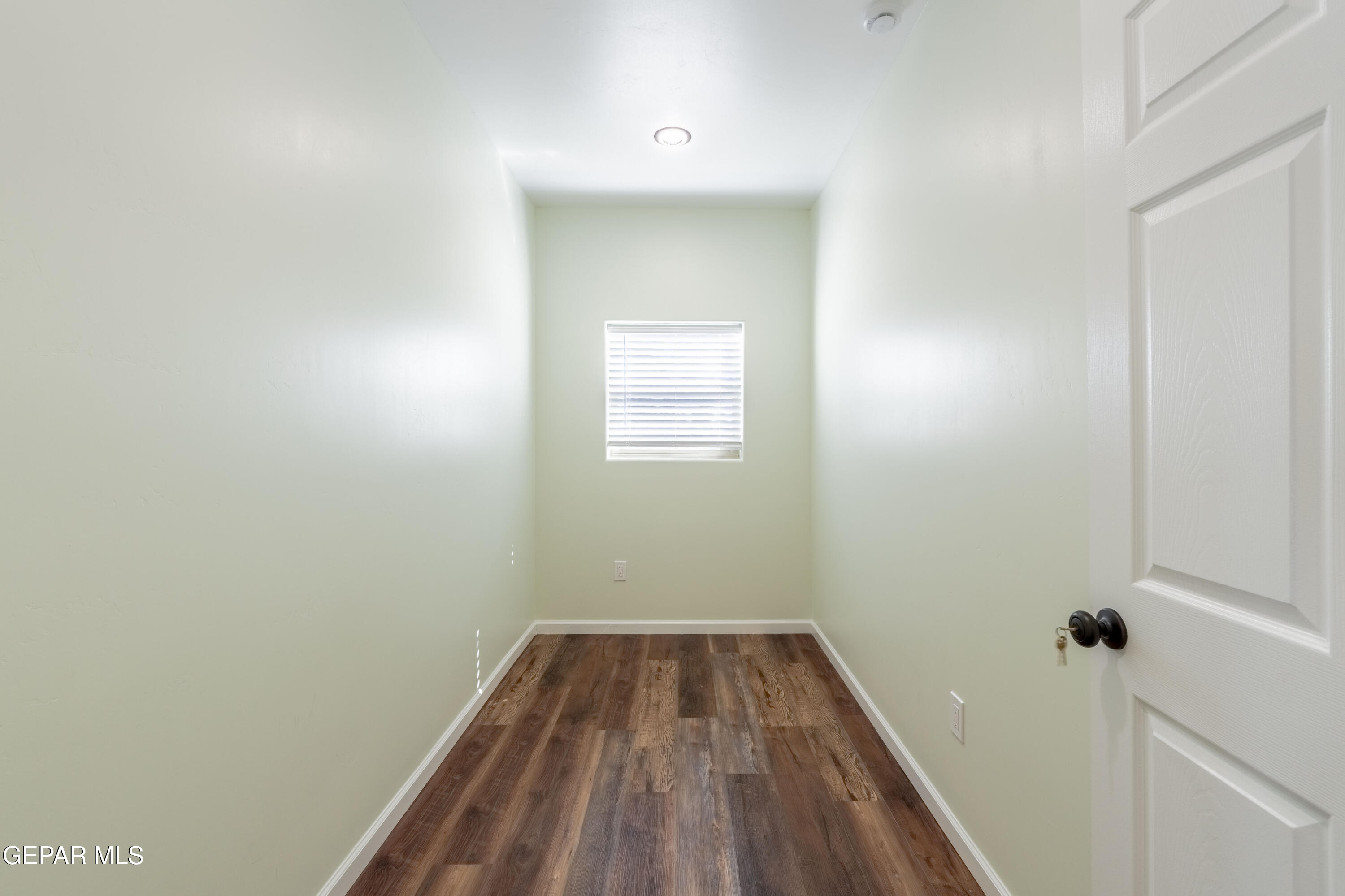 646 Snow Road, Unit 2 Las Cruces, NM 88005 - Photo 36 of 41 a view of a small space with a hardwood and floor to ceiling window