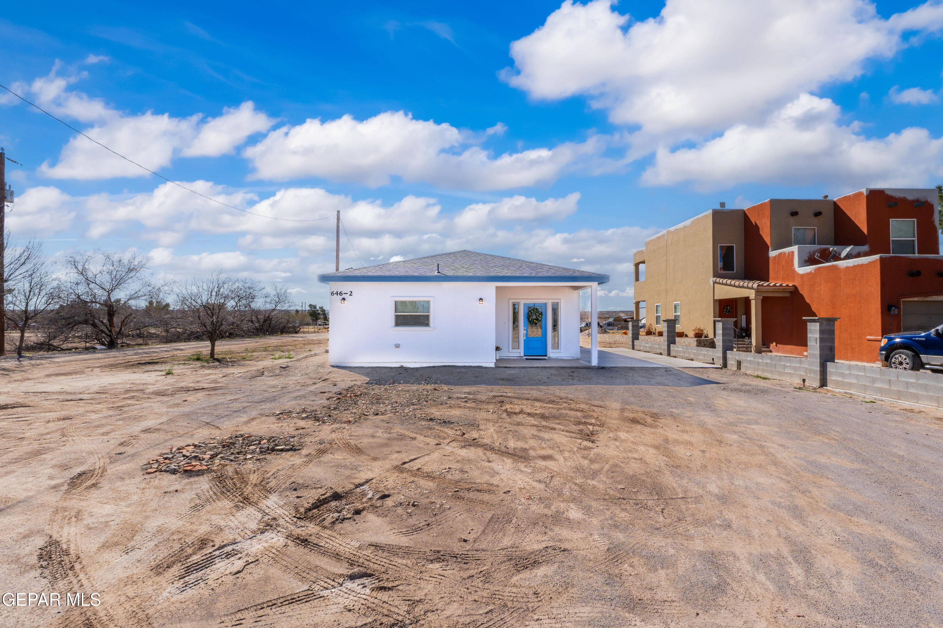 646 Snow Road, Unit 2 Las Cruces, NM 88005 - Photo 40 of 41 a view of a house with backyard and a tree